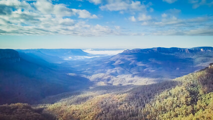 The Blue Mountains are a mountainous region and a mountain range located in New South Wales, Australia. The region is considered to be part of the western outskirts of the Greater Sydney area. 