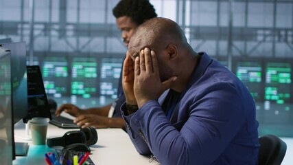 Stressed engineer finally relaxing after receiving access granted notification while reconfiguring server hub. Tense admin lightens up after managing to successfully eliminate all errors - Powered by Adobe