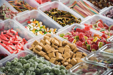 Handmade sweets in plastic boxes on the counter