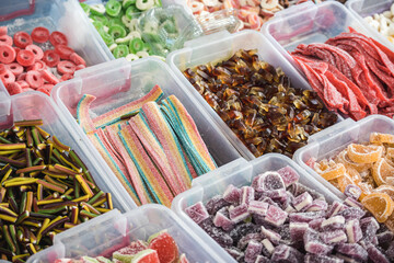 Handmade sweets in plastic boxes on the counter