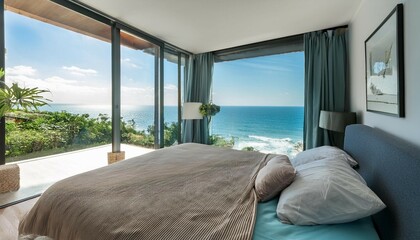 Fototapeta premium a bedroom with a large window overlooking the ocean