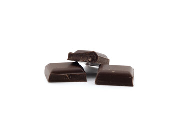 Small dark chocolate pieces isolated on white background