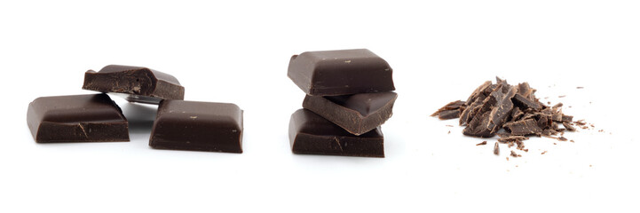 Small dark chocolate pieces isolated on white background
