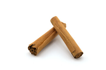Cinnamon sticks and ground cinnamon isolated on a white background. Cinnamon spice.
