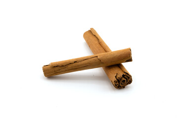 Cinnamon sticks and ground cinnamon isolated on a white background. Cinnamon spice.