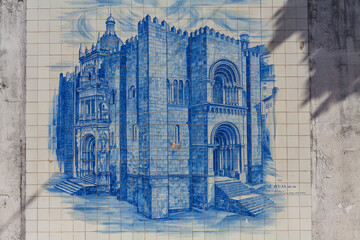 A beautiful azulejo tile mural depicting the Old Cathedral of Coimbra, a historic landmark in the city