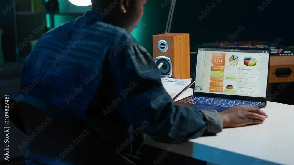 Poster accountant working from home taking notes on financial documents, analyzing sales report to plan bus