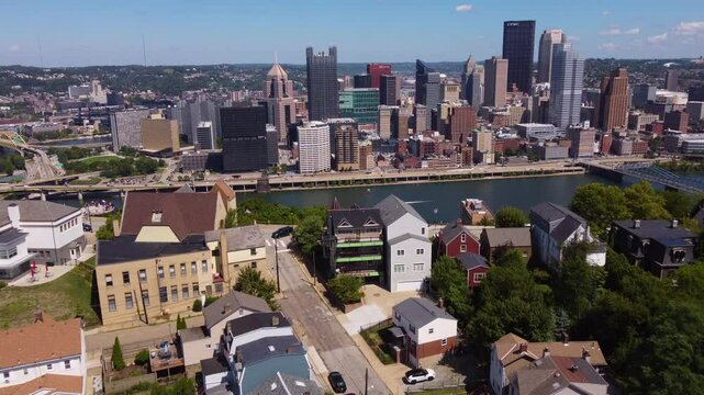 Take in the diverse and vibrant scenery of Pittsburgh with this captivating aerial drone footage. The flight begins over a picturesque neighborhood, then over the river and into the city skyline.