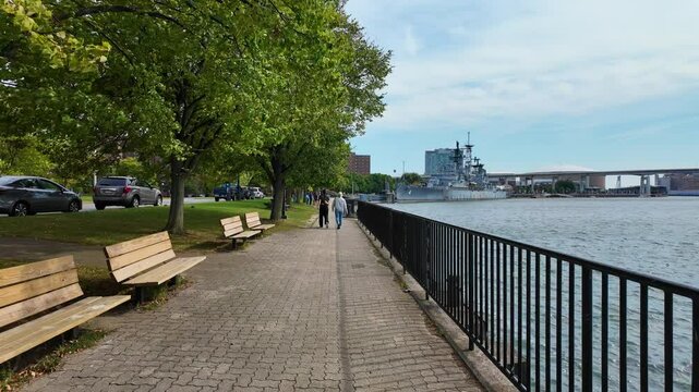 Feel the brisk breeze and scenic charm of Buffalo with this POV Steadicam footage capturing a walk along the Buffalo Waterfront on a windy day. 