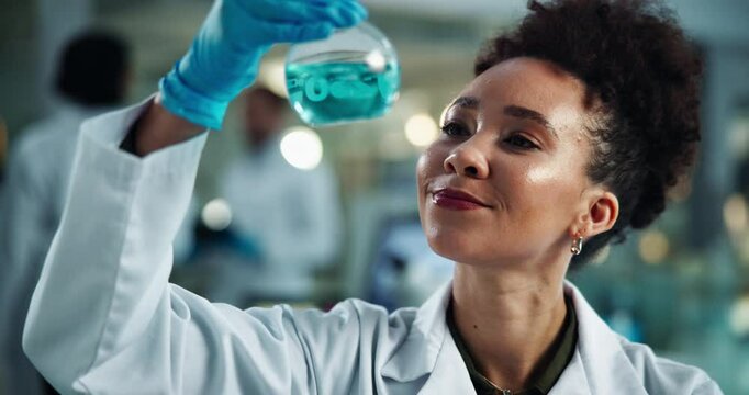 Scientist, woman and chemical in beaker with smile for chemistry, experiment and medical research. Laboratory, analysis and expert with liquid inspection for pharmaceutical or pathology study