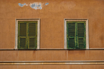 Green Shutters on Old Plaster Wall