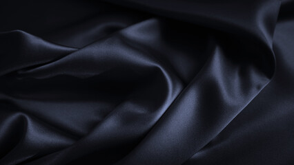 Black dark blue background. Silk satin fabric. Elegant luxury beautiful. Silky shine shimmer silvery. Soft folds. For design.