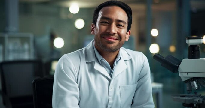 Face, man and scientist with microscope in laboratory for forensic, examination and experiment. Male person, doctor and happiness in portrait on tech for analysis testing, results or medical research