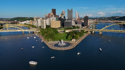 Experience the dynamic beauty of Pittsburgh with this stunning aerial drone footage. This clip captures a serene flight over the river in Pittsburgh, PA, where numerous boats float gracefully below. 