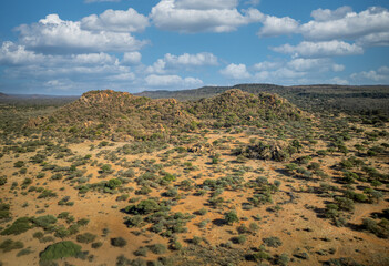 aerial view african landscape southern Africa, mountain range and hills, savannah plain with acacia...