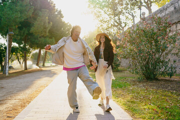 Fototapeta premium A Joyful Couple Walking Together in Beautiful Nature, Embracing Their Bonding Adventure