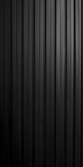 A close-up of a textured black corrugated surface.