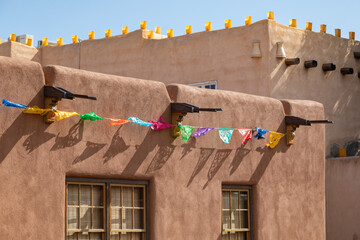 Adobe Brown Mud Architecture Walls Adorned with Colorful Papel Paper Flags in Albuquerque New Mexico