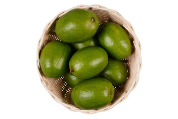 Fresh kedondong or ambarella fruit in a woven bamboo container isolated transparent