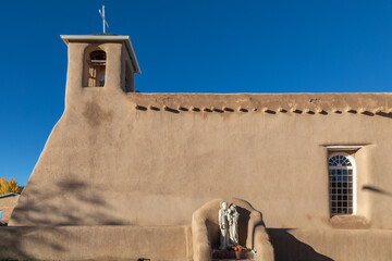 Side View of San Francisco de Asis Catholic Church in Taos, New Mexico on an Early Autumn Morning