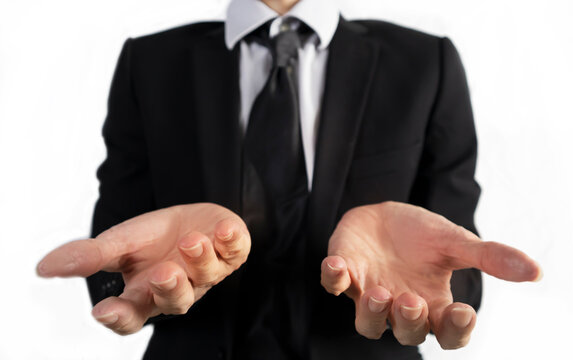 Businessman in black suit standing with open hands showing Business project explanation