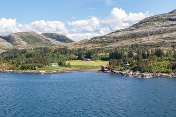 Beautiful Green Farm Land Along the Remote Coast in Northern Norway near Kråkøya, in the Horsvær Area, Midsummer Day, Puffy Clouds