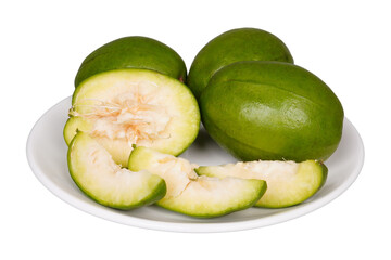 Whole kedondong or ambarella fruit with slices on a white plate isolated transparent