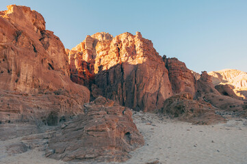 A rocky mountain range with a clear blue sky