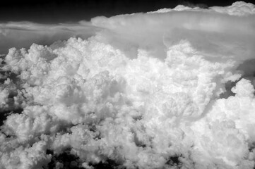 The sky is filled with clouds, and the clouds are white