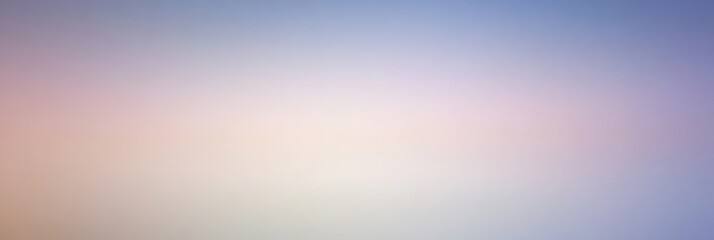 Obraz premium A soft, blurred gradient of pastel colors creating a serene and calming atmosphere.