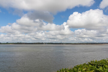 Looking across the Menai Straits to Anglesey from Caernarvon, North Wales, UK