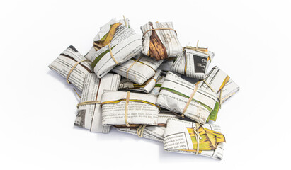 Fresh tempeh isolated on white background, Indonesian traditional food. Banana leaf and paper-wrapped tempeh is known tasty than the plastic-wrapped one