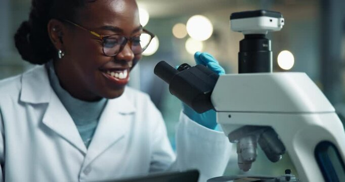 Scientist, black woman and microscope with smile for research, experiment and medical chemistry. Chemical analysis, expert and happy with liquid inspection for pharmaceutical study report success
