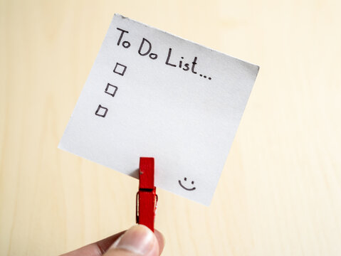 Organizing your day to-do list essentials home office note minimalist close-up productivity tips - Powered by Adobe