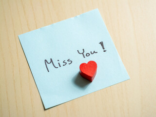 Miss you note home personal message indoor close-up sentimental gesture