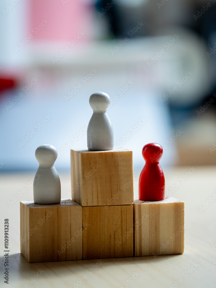 Aufkleber teamwork and progress wooden figures on blocks in an office space concept