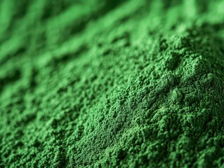 Close-up of vibrantly colored spirulina powder.