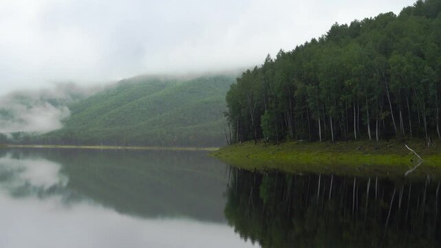 Zeya Reservoir. A beautiful calm lake among green hills.