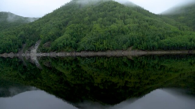 Zeya Reservoir. A beautiful calm lake among green hills.