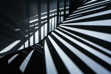 Obraz premium Abstract shadows cast on a staircase, creating a dynamic interplay of light and lines.
