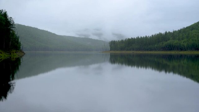 Zeya Reservoir. A beautiful calm lake among green hills.
