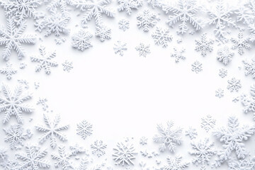 Elegant snowflakes scattered on a pristine white surface create a serene winter mood, perfect for holiday cards, winter events, and minimalist designs.