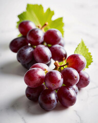 Fototapeta premium Fresh Red Grapes With Green Leaves With Clean White Table for Simple Minimalist Dining Setup with Fresh Fruit