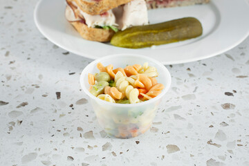 A view of a side of pasta salad.