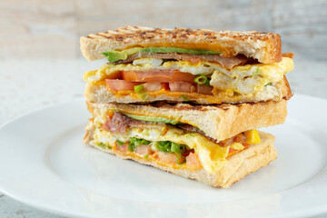 A view of a breakfast panini sandwich stack.