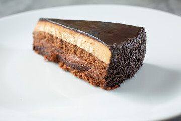 A view of a chocolate and coffee cheesecake slice.