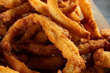 A closeup view of a pile of onion rings.
