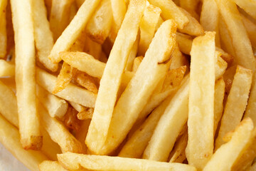 A top down view of a basket of french fries.