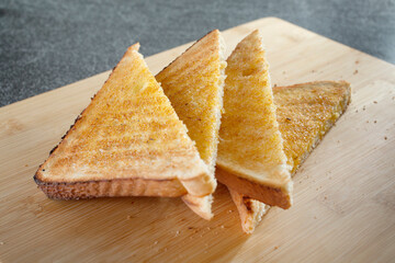 A view of slices of buttered toast.