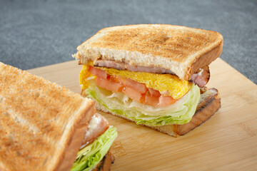 A view of a ham and egg breakfast sandwich.